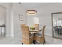 Bright dining room showcasing modern lighting, neutral paint, and stylish decor for a welcoming atmosphere at 2193 Bonito Way, Port Charlotte, FL 33953