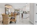 Open-concept layout connects dining, living, and kitchen areas, perfect for entertaining and Gathering gatherings at 2193 Bonito Way, Port Charlotte, FL 33953