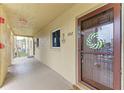 Inviting unit entrance with wreath on door; a welcome home feel at 3562 Lake Bayshore Dr # 202, Bradenton, FL 34205