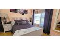 Comfortable bedroom with a large window providing ample natural light and calming lake view at 3915 40Th W St, Bradenton, FL 34205
