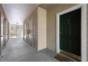 Apartment hallway with numbered doors, leading to an outdoor staircase at 5122 Northridge Rd # 112, Sarasota, FL 34238