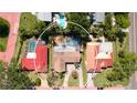 A private single-Gathering home with in-ground pool in a neighborhood surrounded by lush landscaping and mature trees at 7019 10Th S St, St Petersburg, FL 33705