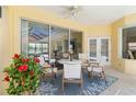 Charming outdoor patio featuring comfortable seating, a ceiling fan, and scenic views, ideal for relaxation and entertaining at 7270 Alicante Dr # 3, Sarasota, FL 34238