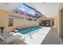 Beautiful screened-in pool with tile accents, surrounded by ample seating and sunlight, creating a perfect outdoor oasis at 7270 Alicante Dr # 3, Sarasota, FL 34238