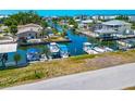 Waterfront homes with boats docked in canals, offering direct access to the water at 8152 Seashell St, Englewood, FL 34224