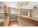 Stylish bar area featuring granite countertops, wood floors and sliding door access to the outdoors at 919 80Th Nw St, Bradenton, FL 34209