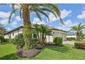 Exterior showcasing landscaping with palm trees surrounding the property at 12210 Goldenrod Ave, Bradenton, FL 34212