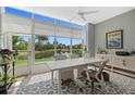 Bright office space with a large window overlooking a serene water view and lush greenery at 197 Tropicana Dr # 1511, Punta Gorda, FL 33950