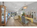 Bright living room with open floor plan, dining area, and nautical decor at 245 Coldeway Dr # B10, Punta Gorda, FL 33950