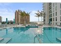 Stunning rooftop pool and hot tub offer breathtaking city views and a relaxing oasis under the sun at 301 Quay Commons # 1204, Sarasota, FL 34236