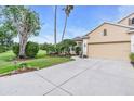 Beautiful property showcasing a large driveway and mature landscaping at 3514 92Nd E Ave, Parrish, FL 34219