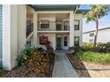 Charming two-story condo building with landscaped pathway leading to the entrance at 4325 46Th W Ave # 104, Bradenton, FL 34210