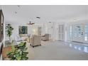 Bright and airy living room with ample seating, neutral décor, and a welcoming atmosphere for comfortable living at 4487 Glebe Farm Rd, Sarasota, FL 34235