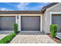 Spacious garage with lush landscaping at 5694 Palmer Cir # 202, Bradenton, FL 34211