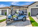Golf cart parked in the driveway of the home at 5694 Palmer Cir # 202, Bradenton, FL 34211