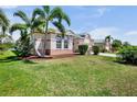 Well-manicured lawn with mature palms accentuates this lovely single-Gathering home at 6311 Sturbridge Ct, Sarasota, FL 34238
