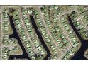 Aerial view of property shows waterfront location on canal in a quiet neighborhood at 6339 Pontiac Ln, North Port, FL 34287
