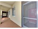 Condo hallway with neutral walls and flooring, showcasing a clean and welcoming entrance at 7705 Grand Estuary Trl # 206, Bradenton, FL 34212
