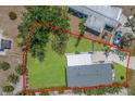 Aerial view of the property showing the house, backyard, and surrounding area at 8225 Drew St, Englewood, FL 34224