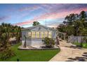 Charming single-story home with well-manicured lawn and inviting curb appeal at 8225 Drew St, Englewood, FL 34224