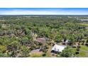 Acreage estate featuring a serene, private setting surrounded by mature trees and lush greenery at 8280 Ibis St, Sarasota, FL 34241