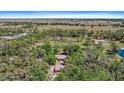 Secluded acreage estate offers a private retreat nestled among lush trees and greenery at 8280 Ibis St, Sarasota, FL 34241