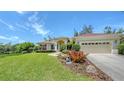 Well-maintained single Gathering home features a meticulously landscaped yard with mature trees at 9238 13Th Avenue Nw Cir, Bradenton, FL 34209