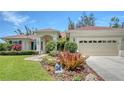Beautiful home boasts a meticulously landscaped yard with a zen garden and a serene Buddha statue at 9238 13Th Avenue Nw Cir, Bradenton, FL 34209