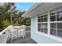 Charming balcony with a stylish dining set, perfect for outdoor dining and enjoying the scenic views at 104 29Th St # 3, Holmes Beach, FL 34217
