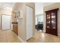 Neutral color kitchen, dining, and sitting area leading to a private balcony at 1064 N Tamiami Trl # 1425, Sarasota, FL 34236