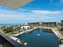 Stunning water views with multiple buildings, palm trees and fountains from the higher floors of the complex at 1095 Gulf Of Mexico Dr # 503, Longboat Key, FL 34228