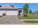 Attractive single-story home showcasing a two-car garage and well-maintained landscaping at 17902 Cherished Loop, Lakewood Ranch, FL 34211