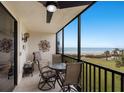 Screened balcony with views of the beach and the Gulf of Mexico at 1925 Gulf Of Mexico Dr # G8-307, Longboat Key, FL 34228
