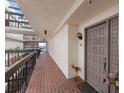 Exterior hallway with beautifully decorated entrance to Unit 307 at 1925 Gulf Of Mexico Dr # G8-307, Longboat Key, FL 34228