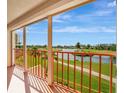 Balcony view of a tranquil pond with a gazebo, walking path and picturesque landscaping at 2311 14Th W Ave # 208, Palmetto, FL 34221