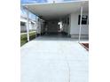 Spacious covered driveway perfect for parking and protection from the elements at 3221 Sweet Bay Ter, Sarasota, FL 34237