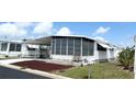 Charming home with covered parking and screened in porch and awnings at 3221 Sweet Bay Ter, Sarasota, FL 34237