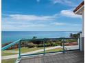 Balcony featuring glass railings, tiled flooring, and picturesque ocean views at 340 Gulf Of Mexico Dr # 124, Longboat Key, FL 34228