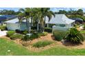 Well-maintained home with mature landscaping and lush green lawn at 3667 Country Place Blvd, Sarasota, FL 34233