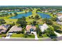 An aerial view showing the proximity of this home to the golf course and community lakes at 3847 Little Country Rd, Parrish, FL 34219
