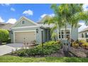 Charming single-Gathering home with an attached two-car garage and tropical landscaping at 7743 Ridgelake Cir, Bradenton, FL 34203
