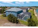 Aerial view of the back of the home, screened in pool and lake at 9307 Raes Creek Pl, Palmetto, FL 34221