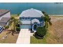Gorgeous aerial view of this two story home with lake view and great landscaping at 9307 Raes Creek Pl, Palmetto, FL 34221