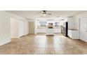 Spacious kitchen featuring white cabinets, stainless steel appliances, and ample countertop space at 2151 Upton Ave, Sarasota, FL 34232