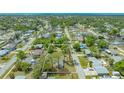 Overhead perspective of the property with outlined lot, surrounded by lush landscaping and neighborhood at 275 Burke Rd, Venice, FL 34293