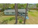 Well-maintained exterior with mature trees, showcasing the home's serene setting at 275 Burke Rd, Venice, FL 34293