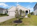 Charming single-story home with a well-manicured lawn and an attached two-car garage at 2812 Rock Sound St, Bradenton, FL 34208