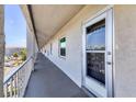 Exterior view of a condominium balcony with door number 407 with secure railing at 3204 Lake Bayshore Dr # 407, Bradenton, FL 34205