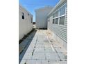 Exterior view shows patio area and side of two houses at 3710 Gulf Of Mexico Dr # A20, Longboat Key, FL 34228