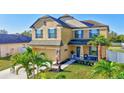Beautiful two-story home showcasing a lush front yard and a covered front porch at 4010 Lindever Ln, Palmetto, FL 34221